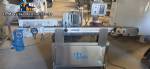 Automatic self-adhesive labeling machine for cylindrical bottles
