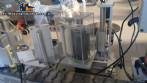 Automatic self-adhesive labeling machine for cylindrical bottles
