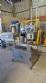 Automatic self-adhesive labeling machine for cylindrical bottles