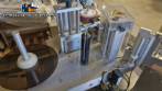 Automatic self-adhesive labeling machine for cylindrical bottles