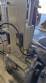 Automatic self-adhesive labeling machine for cylindrical bottles