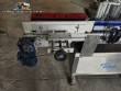 Automatic self-adhesive labeling machine for cylindrical bottles