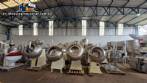 Set of ten stainless steel coating pans with capacities between 150 liters and 350 liters
