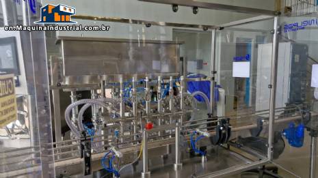 Complete filling line with Tecman Nelpas Tecnoenvase Tudela bottle filling, labeling, capping, and positioning machines for cosmetic liquids.