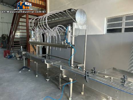 Semi-automatic linear filling machine with capping system