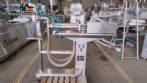Filling machine with 2 nozzles for liquids and pilfer cap screwer