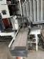 Automatic baling machine with shrink tunnel for bottles and jars in bales.