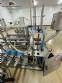 Automatic stainless steel filling machine for a�a� jars, Bramak ice cream