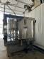 Packaging line with IMSB bung capper, Maqmundi labeler and accumulator table
