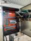 Packaging line with IMSB bung capper, Maqmundi labeler and accumulator table