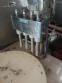 Erli rotary liquid filling machine with 4 pistons, 14,400 units per hour.