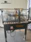 Adhesive tape case sealer with safety enclosure and door sensors Strapack