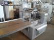 Varied flow pack wrapping machines