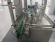 Automatic rotary filling, dosing, and sealing machine for communion cups and small cups.
