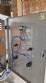 Labeling machine with steam sleeve tunnel and bottle baler