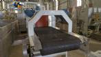 Labeling machine with steam sleeve tunnel and bottle baler
