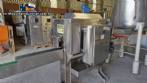 Labeling machine with steam sleeve tunnel and bottle baler