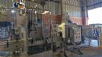 Labeling machine with steam sleeve tunnel and bottle baler