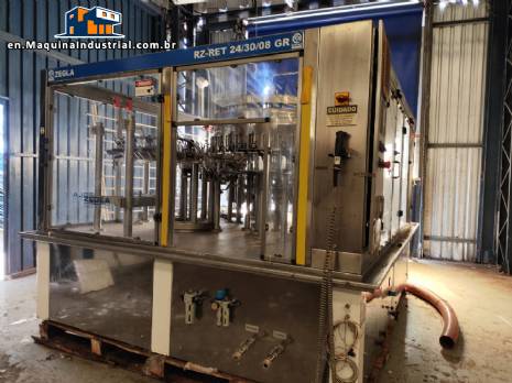Zegla rotary filling machine with rinser and three-block capping system.