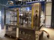 Zegla rotary filling machine with rinser and three-block capping system.