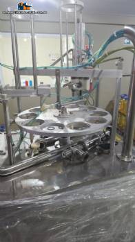 Rotary filling machine with capping and sealing unit for Mirainox cups and jars for pasty products.