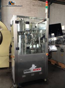 Filling machine for plastic tubes